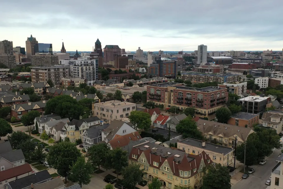 Aerial view of Milwaukee, Wisconsin skyline with large old homes in the foreground